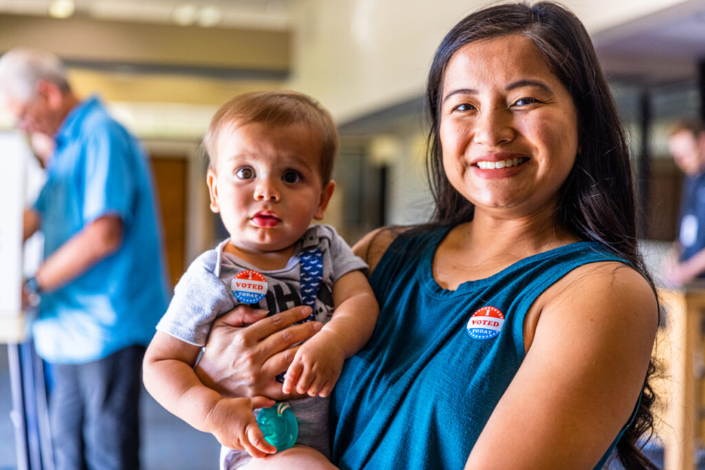 Filipino Woman and her baby boy after voting in an American Election